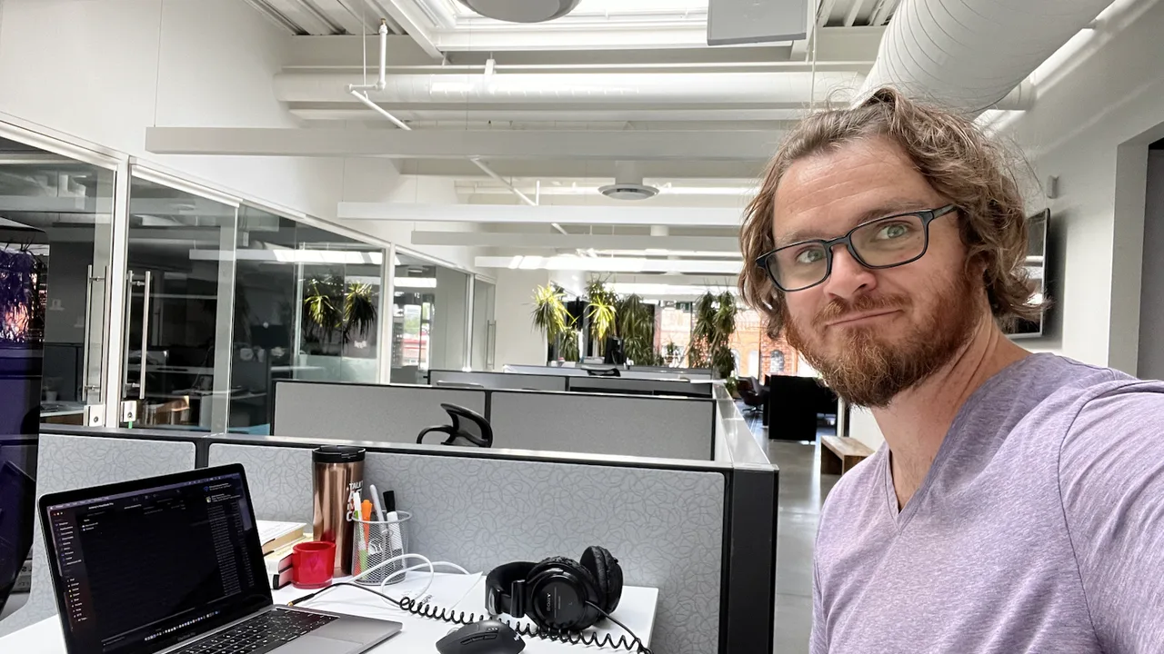 Self portrait beside a laptop in a production office