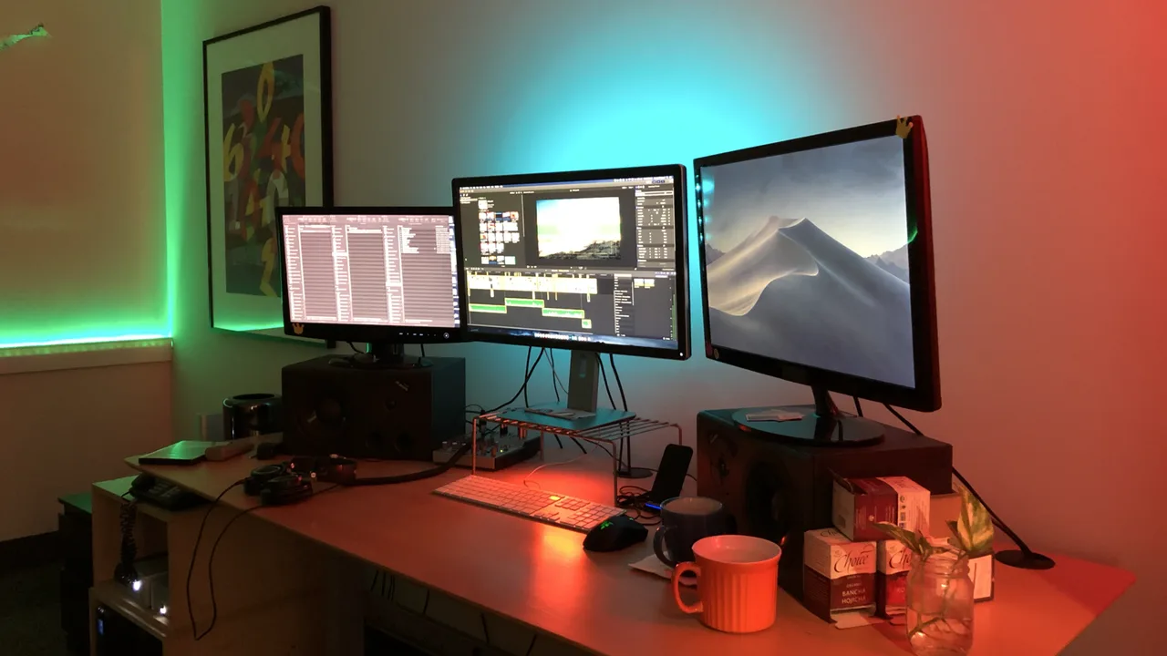 RGB-lit editing desk with a pair of monitors